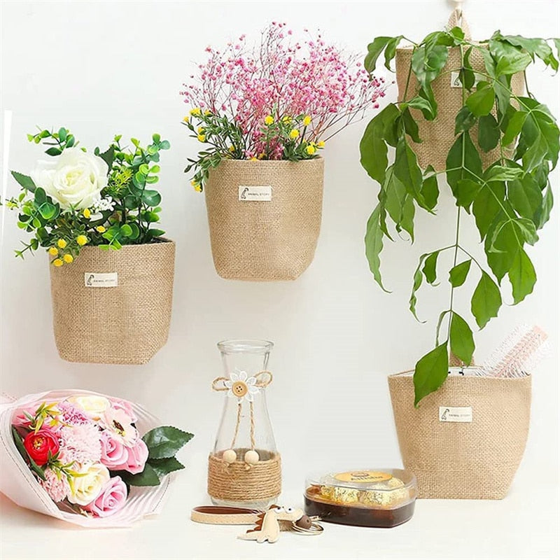 Woven hanging wall storage basket shaped like a bag – shown in a room setting (3)