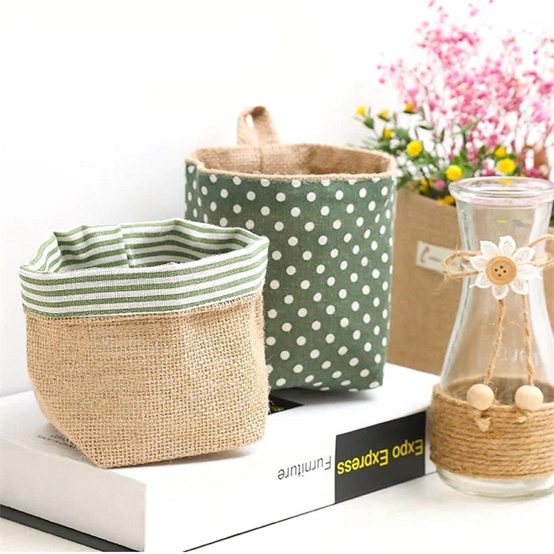 Woven hanging wall storage basket shaped like a bag – shown in a room setting (2)