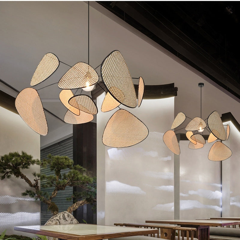 Modern geometric chandelier in rattan with woven bamboo slats – shown in a room setting (2)