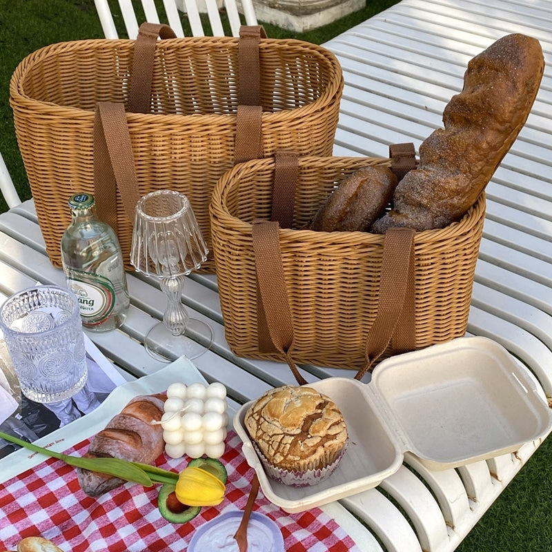 Woven picnic basket with soft, flexible handles – shown in a room setting (2)
