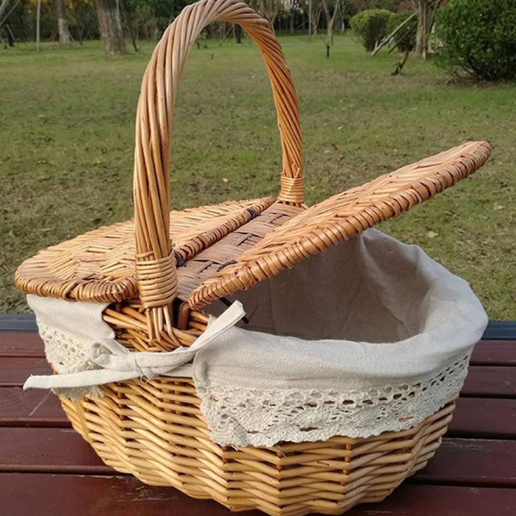 Woven rattan basket with a flip lid – shown in a room setting