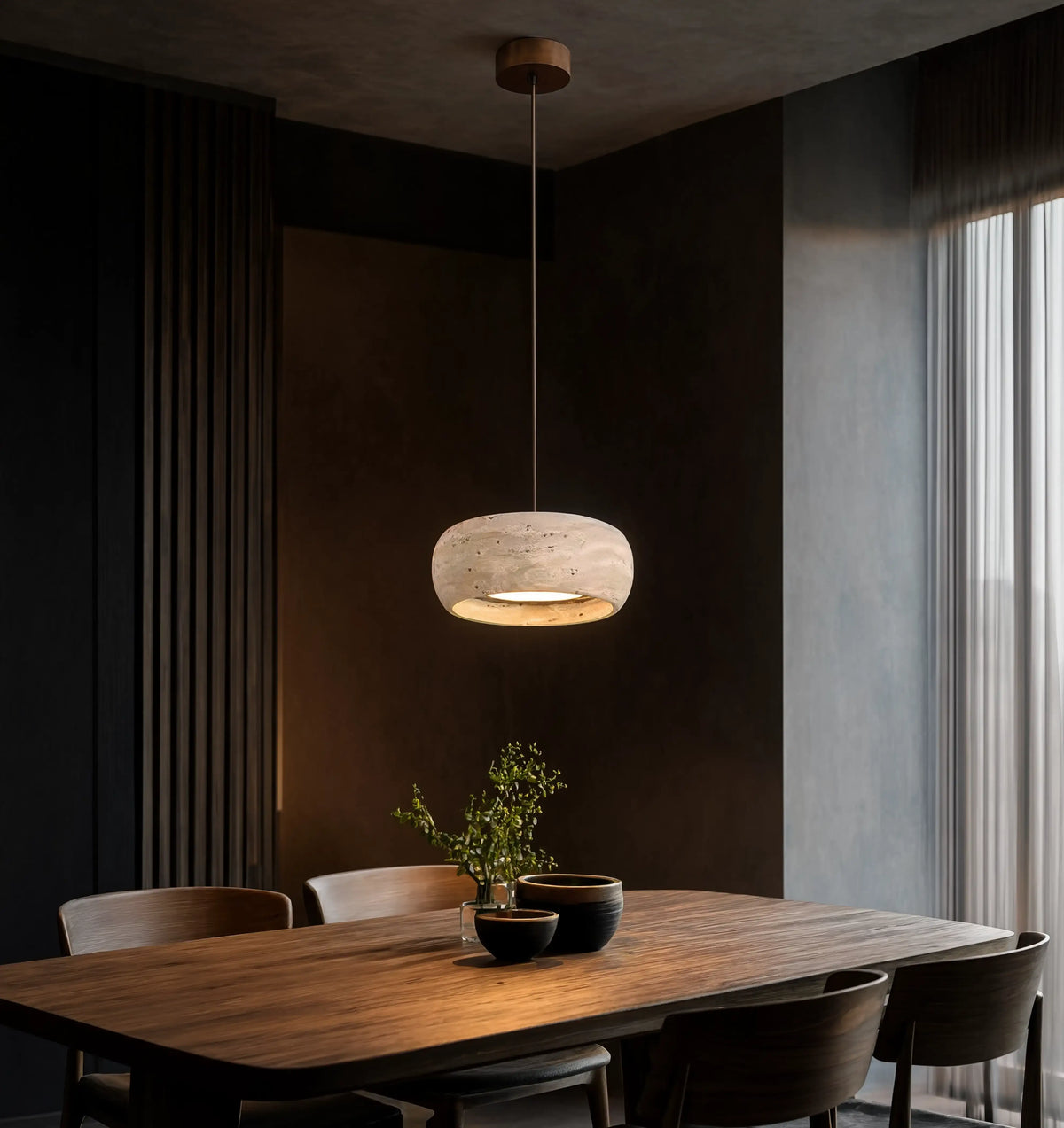 Claros travertine ring pendant light – shown in a dining room