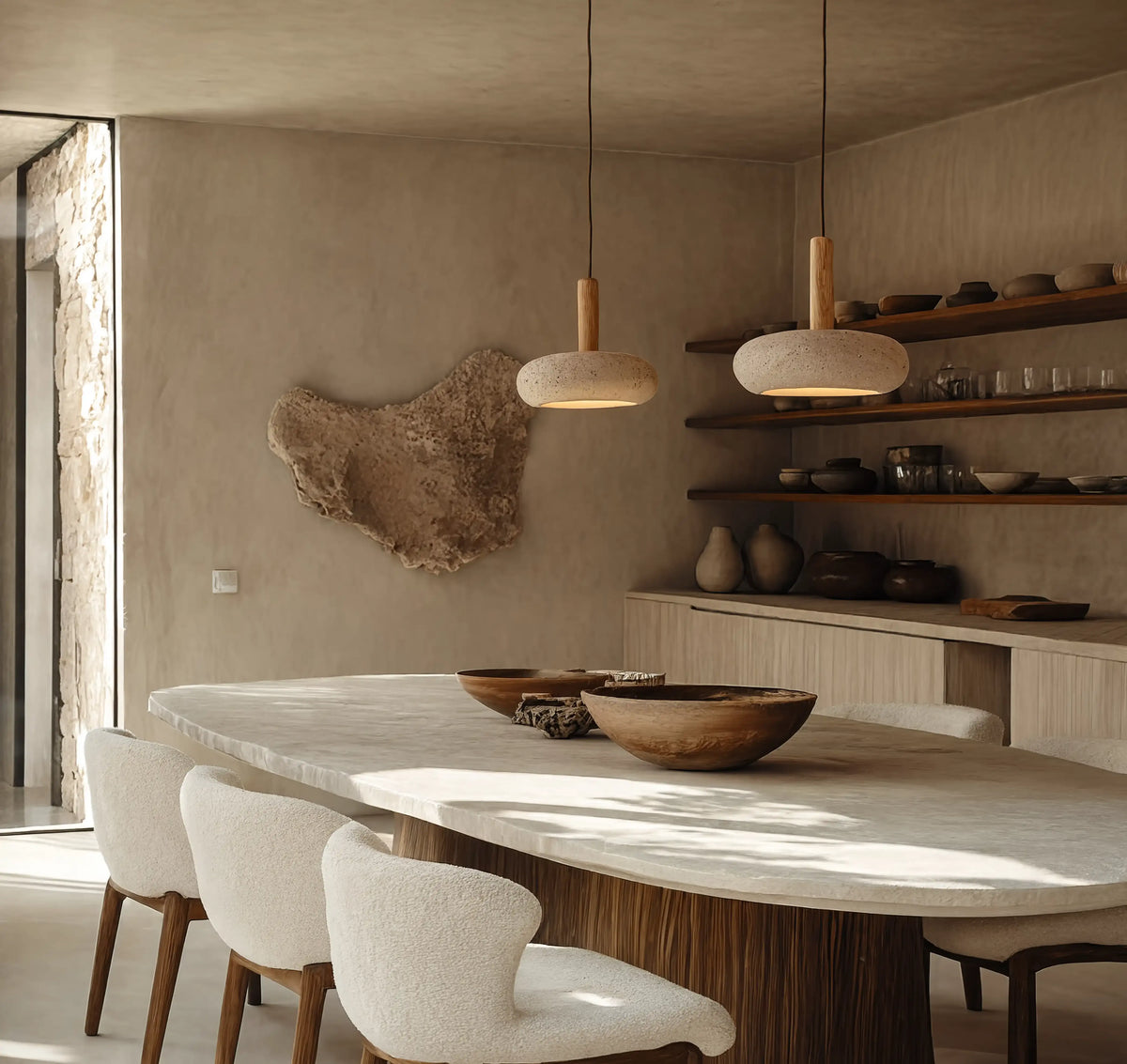 Nora low-profile travertine and light wood pendant light – shown in a room setting