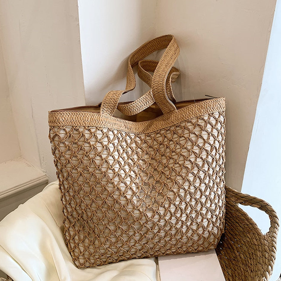 Golden woven handbag with a central zipper