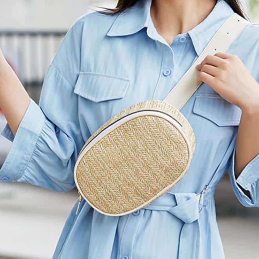 Round woven straw belt bag – worn by a model (2)