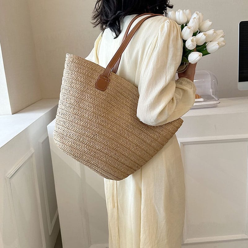 Woven rattan tote with large handles – worn by a model (2)