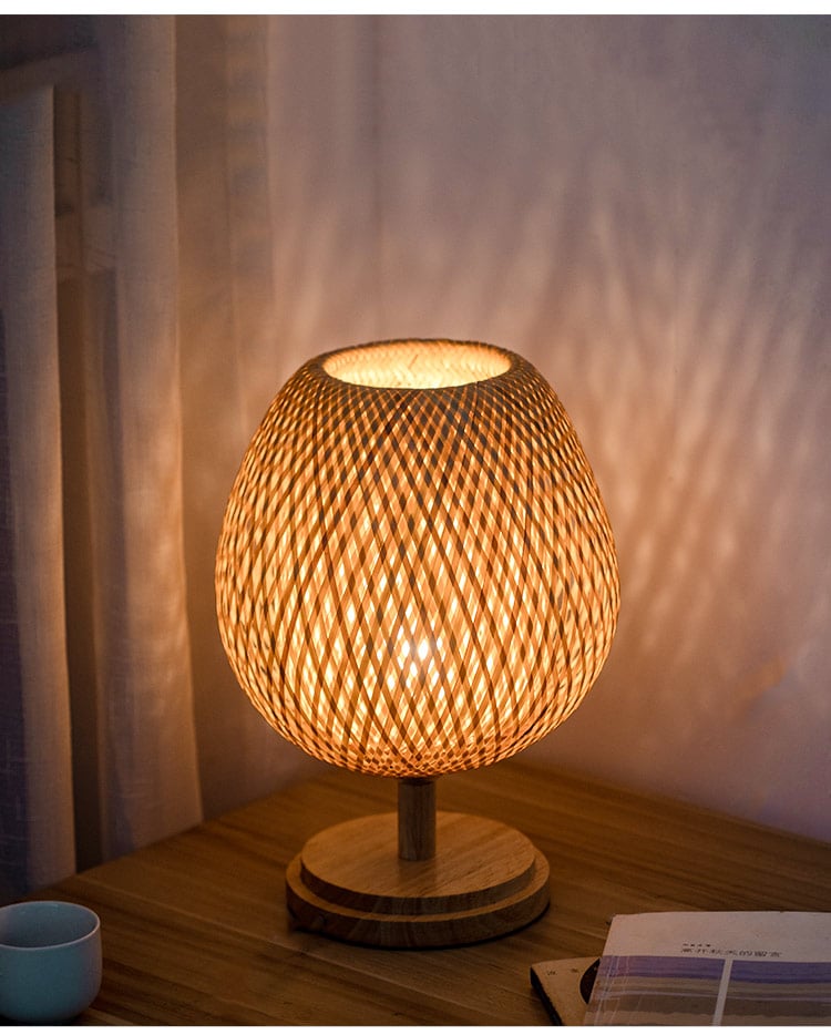 Handwoven natural rattan table lamp – S variant, shown lit
