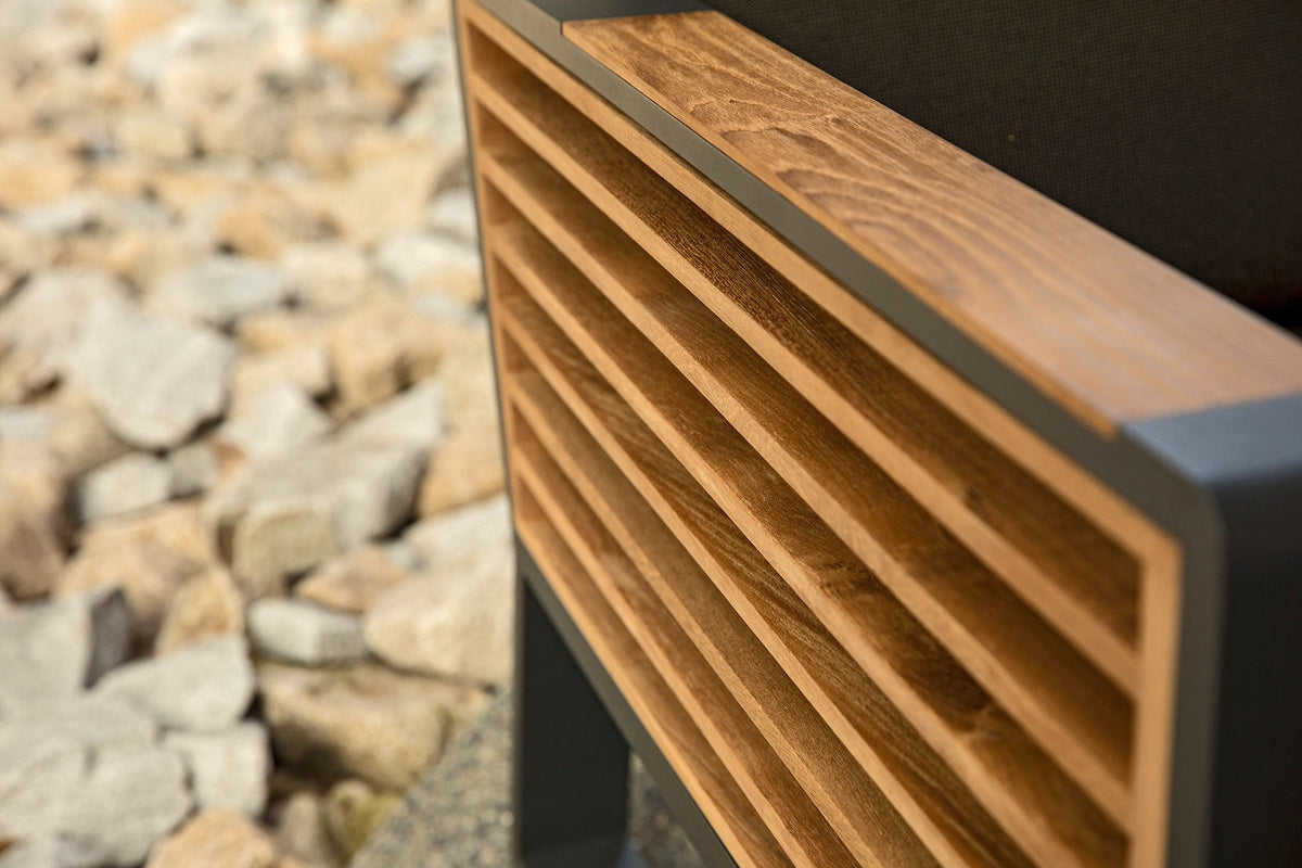 Cofy teak slat outdoor dining armchair with black aluminum legs – close-up detail