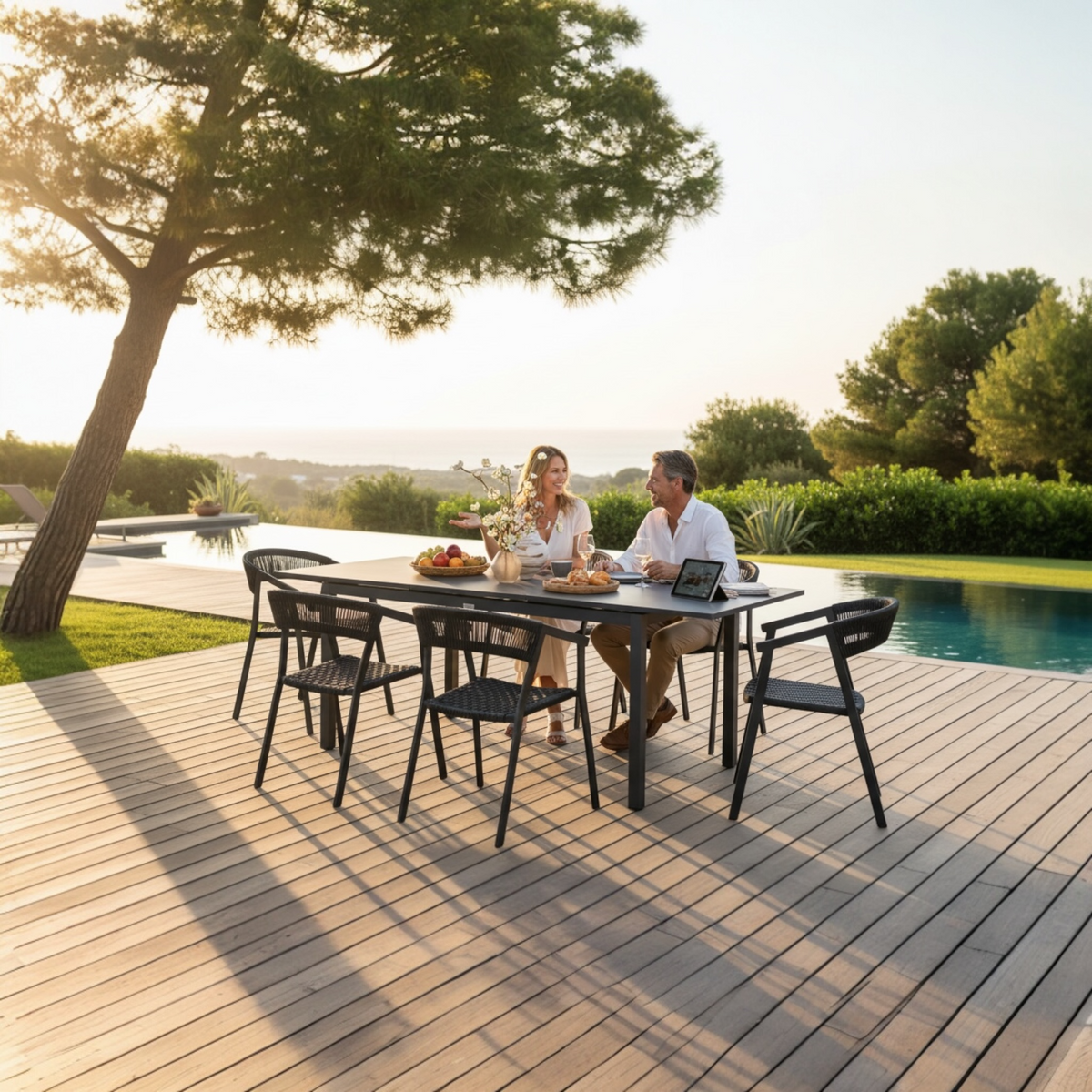 Lou Mini gray extendable aluminum outdoor table – shown outdoors