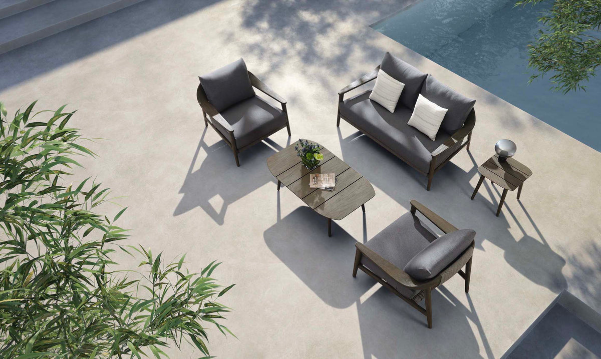 Come solid teak and beige rope patio set with loveseat and two armchairs – shown outdoors (3)