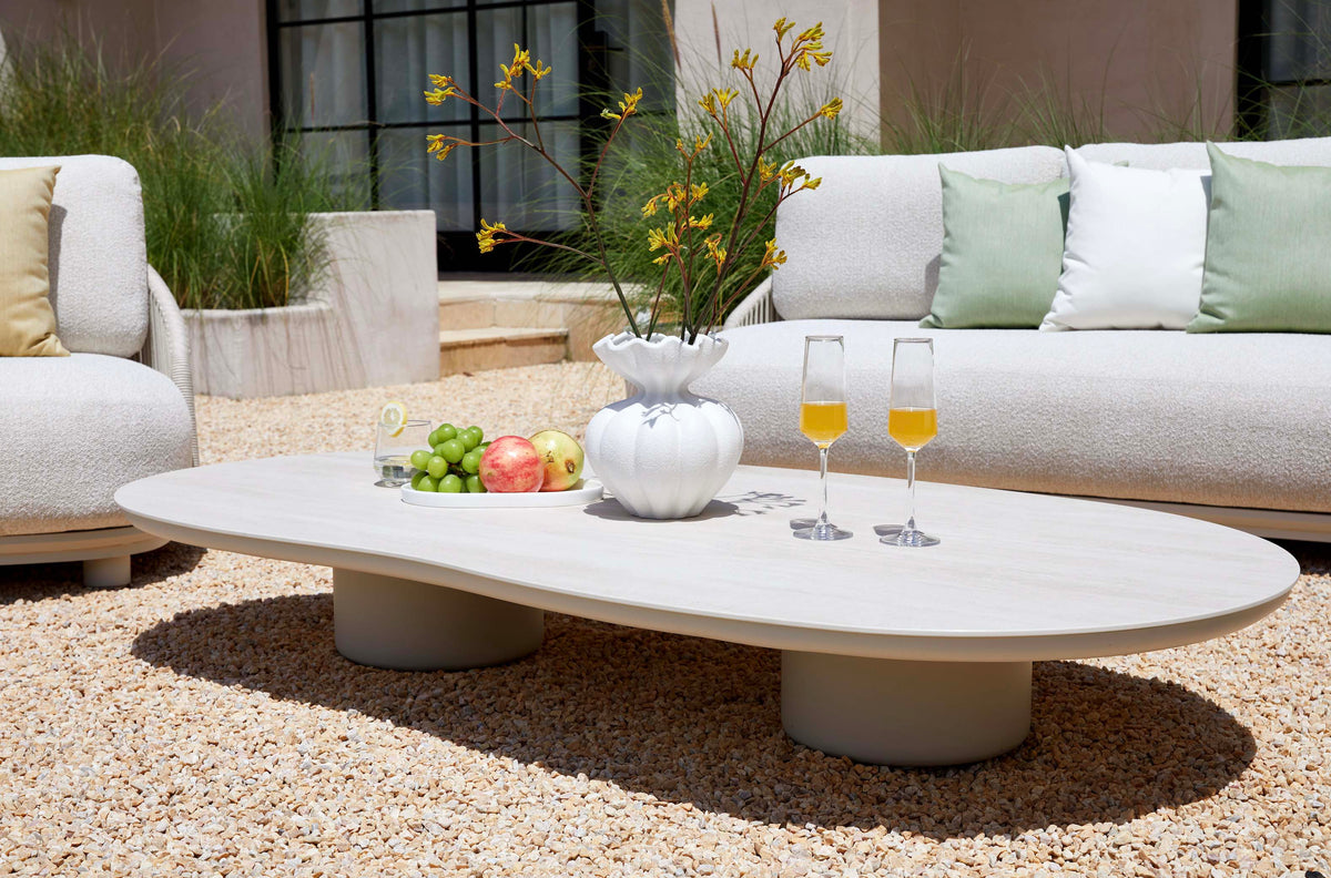 Aura beige rope outdoor lounge set with free-form ceramic coffee table – shown outdoors (7)