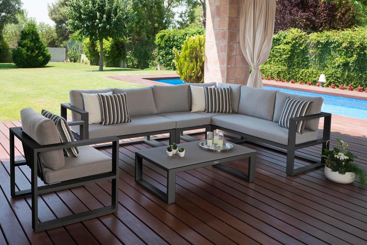 Belly black aluminum outdoor sectional with armchair and tinted glass table – shown outdoors (3)