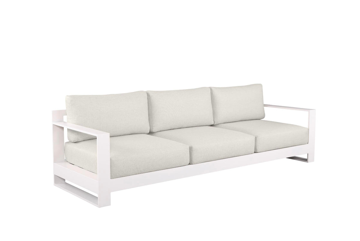 3-seat sofa from the Iris Bis white modular aluminum patio set with light cushions and two coffee tables