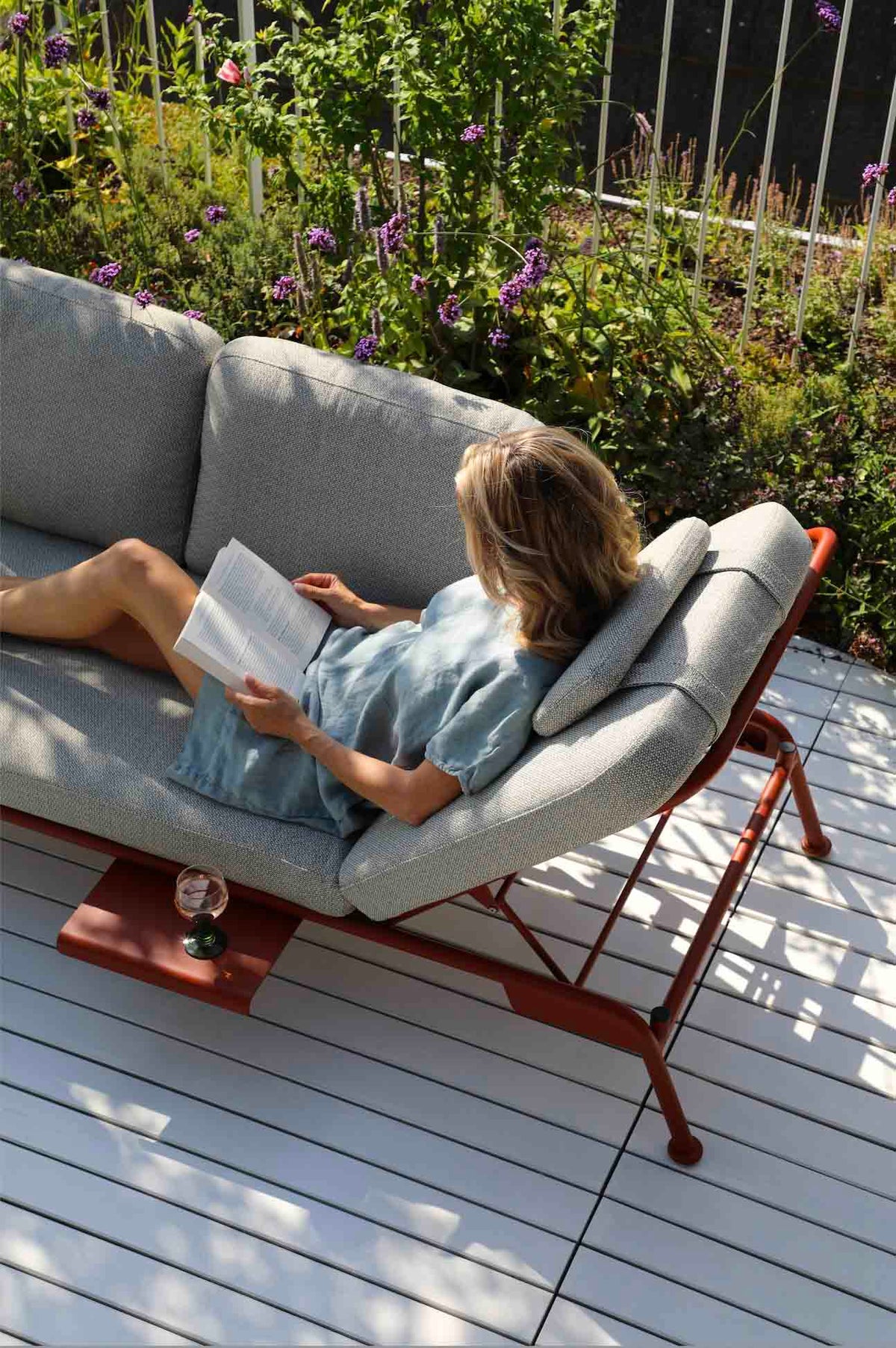 Sunny red convertible aluminum outdoor sofa lounger – shown outdoors (6)