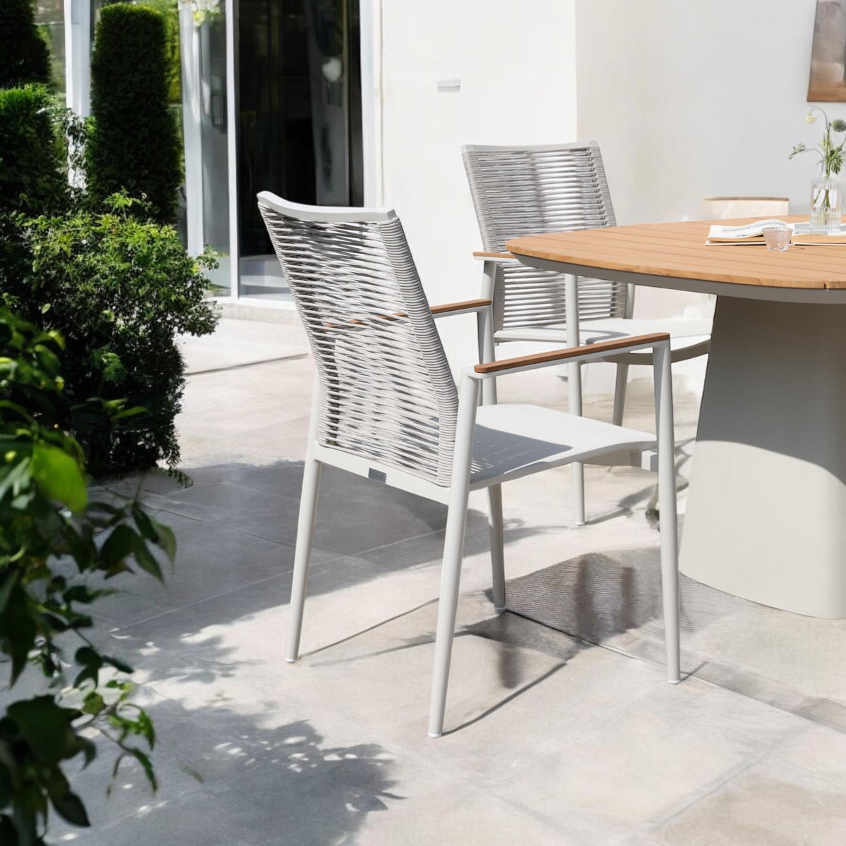 Venus stackable rope dining armchairs with teak arms, set of 2 – shown outdoors (5)