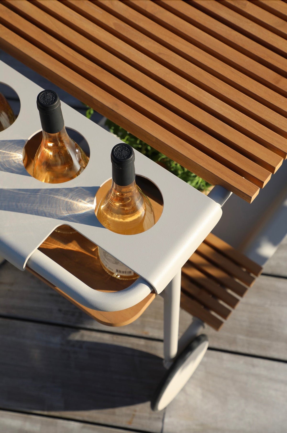 Sunny beige aluminum outdoor bar cart with cooler and teak trays – close-up detail