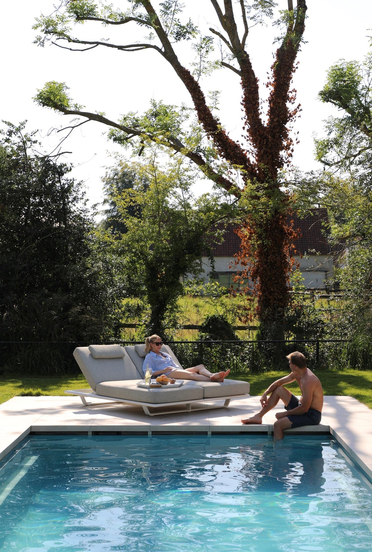 Niri beige aluminum double chaise lounge – shown outdoors (2)