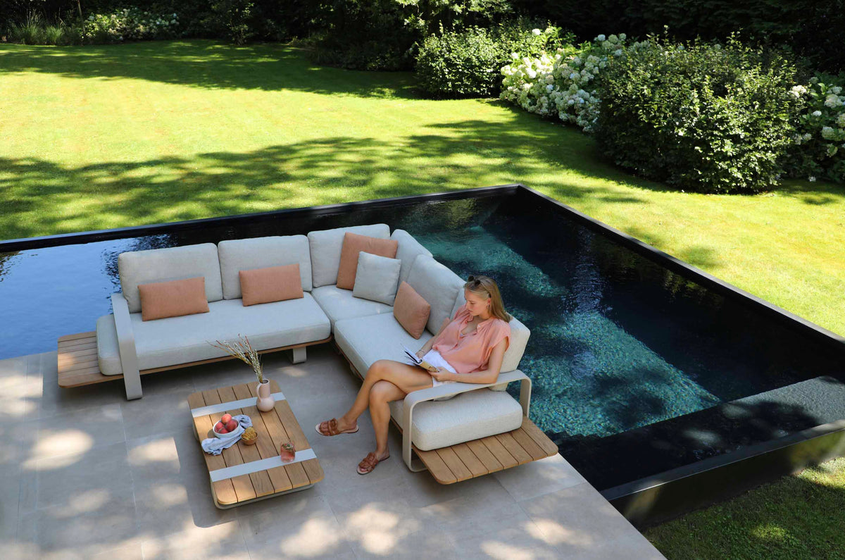 Romeo beige aluminum outdoor sectional with sculpted teak armrests – shown outdoors (3)