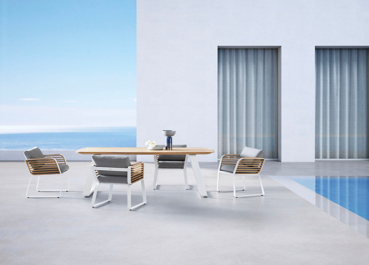 Aily aluminum and teak outdoor dining set with six armchairs – shown outdoors (5)