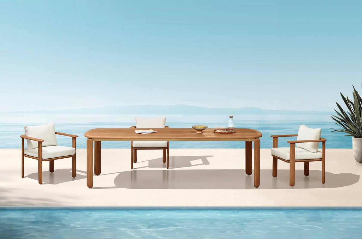 Roma 8-seater solid teak outdoor dining set with slatted armchairs – shown outdoors (4)