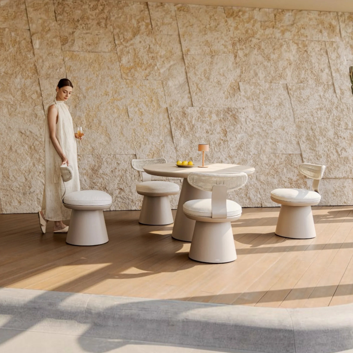 Elyo round ceramic-top outdoor dining set for four – shown outdoors