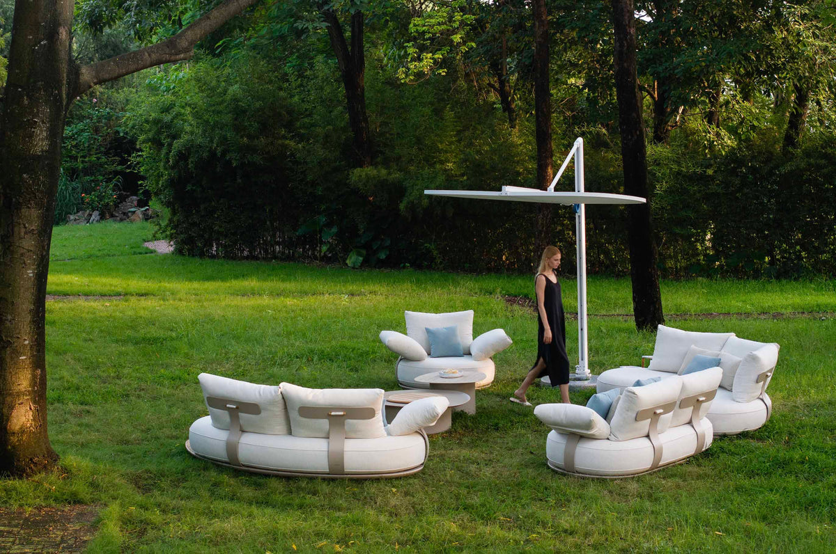 Elyo XL large curved beige aluminum outdoor sectional – shown outdoors (5)