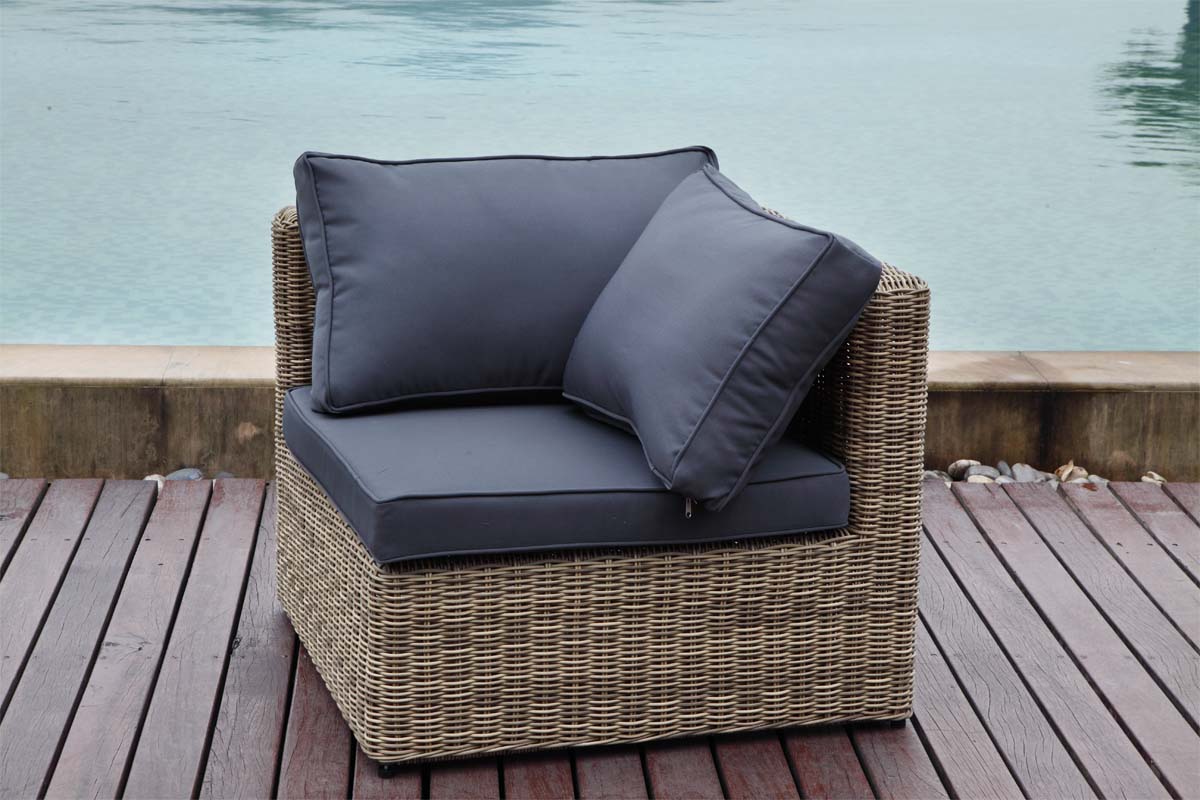 Armchair from the Liberty Chic 7-seat modular resin wicker sectional with poufs – shown outdoors (2)