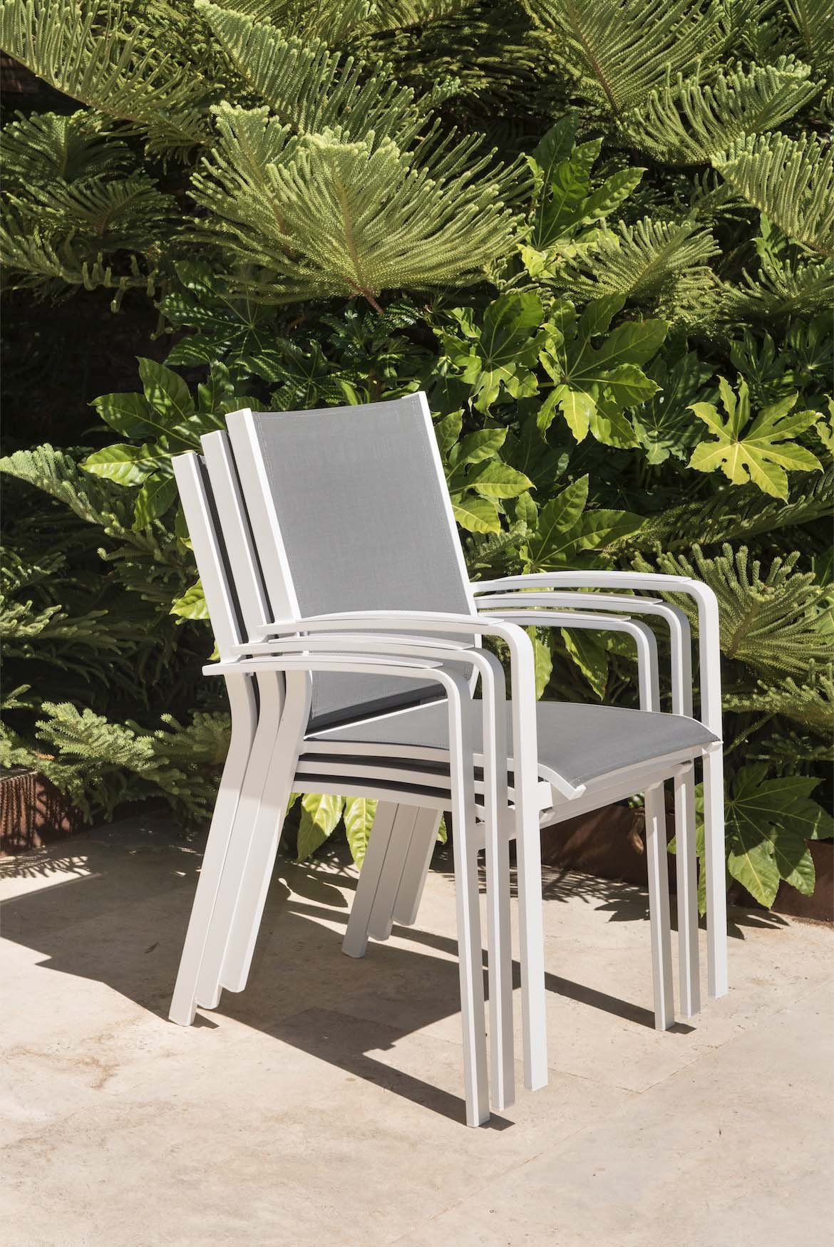 Nory Plus white stackable aluminum dining armchairs, set of 6 – shown outdoors (3)