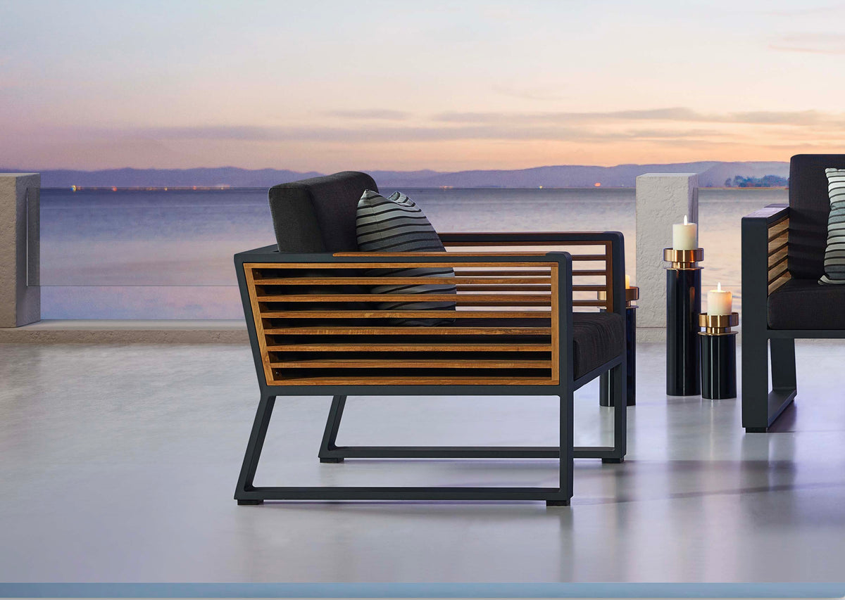 Cofy aluminum and teak outdoor armchair – shown outdoors (4)