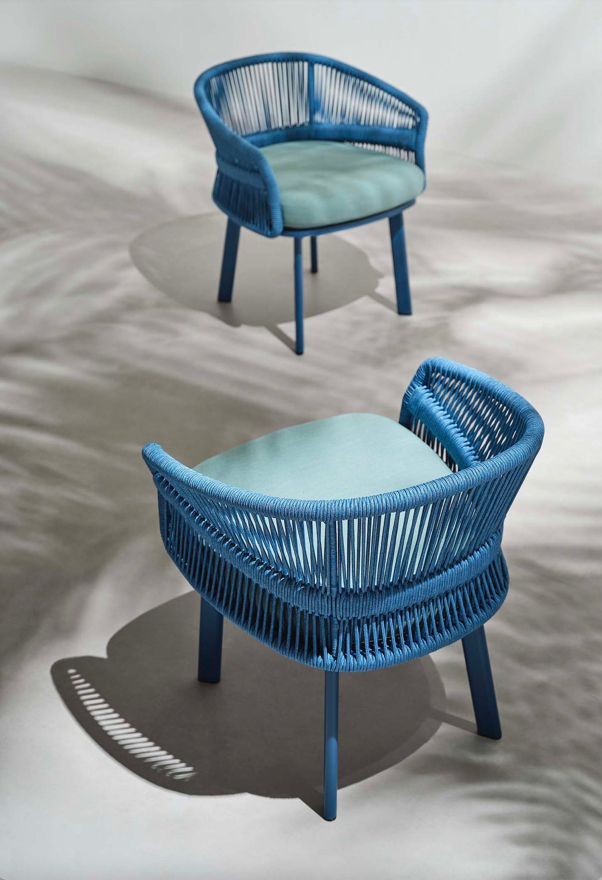 Armchair from the Laska 6-seat blue rope outdoor dining set – shown outdoors