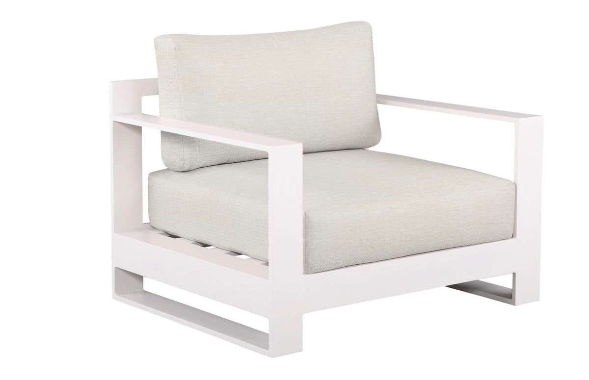 Armchair from the Iris Bis white modular aluminum patio set with light cushions and two coffee tables – another view