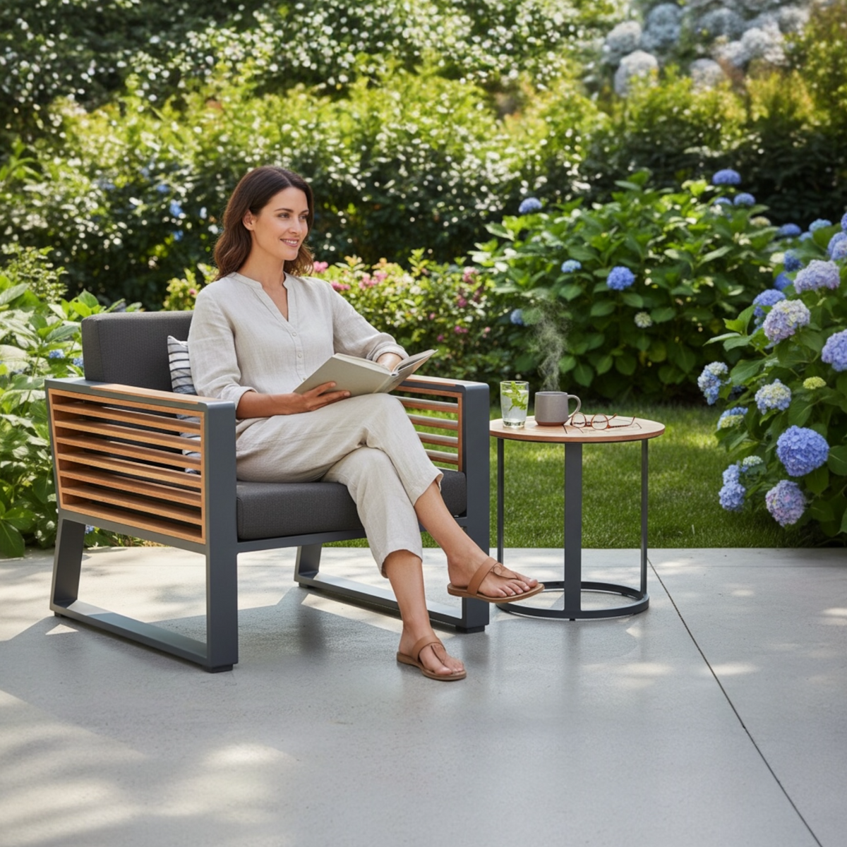 Cofy aluminum and teak outdoor armchair – shown outdoors (2)