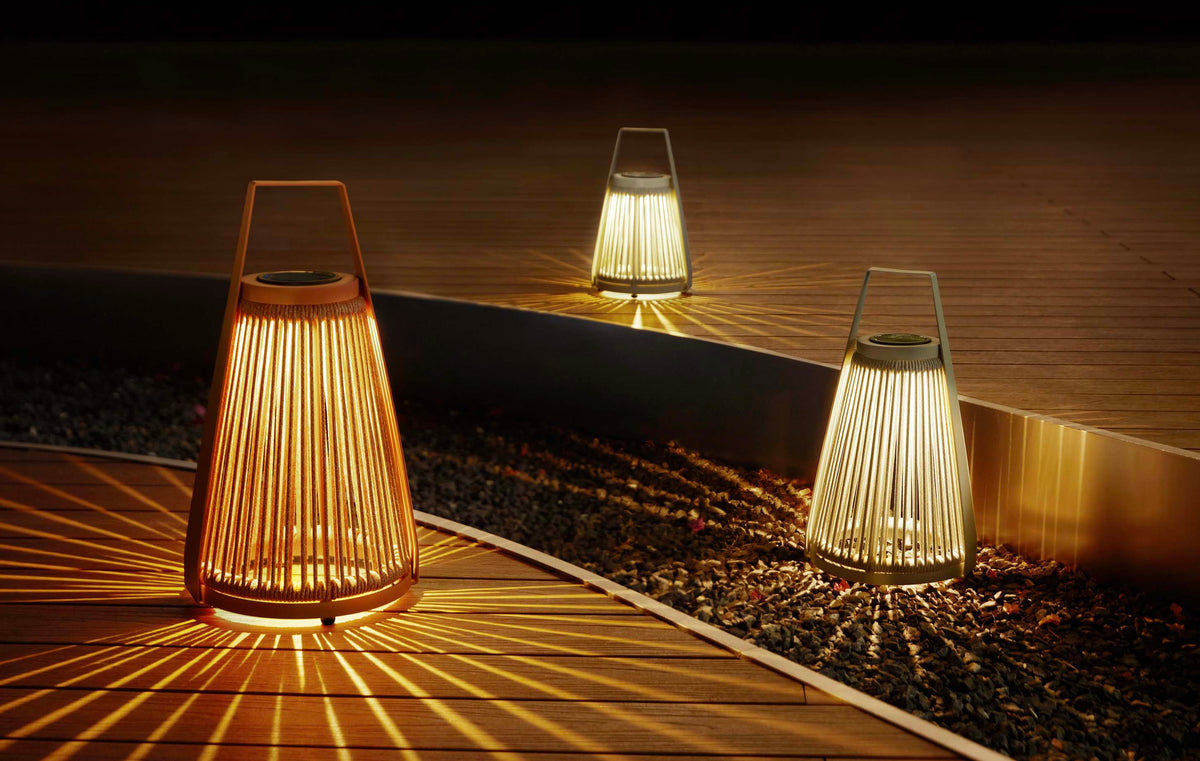 Milan beige rope solar outdoor lamp – shown lit outdoors (2)