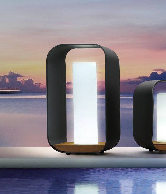 Onda black aluminum and teak cordless outdoor lamp – shown outdoors
