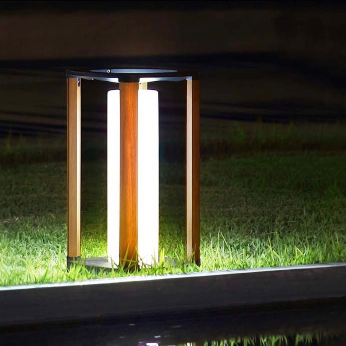 Aurora black solar outdoor lantern, medium – shown lit outdoors
