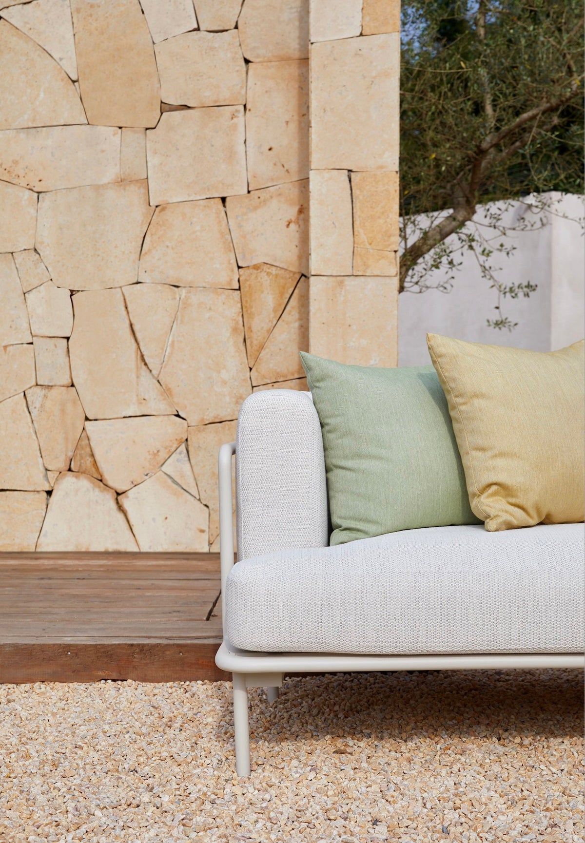 Chaise from the Flora white aluminum outdoor sectional with light gray cushions – close-up detail