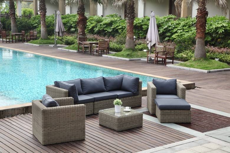 Liberty round resin wicker outdoor ottoman – shown outdoors (4)