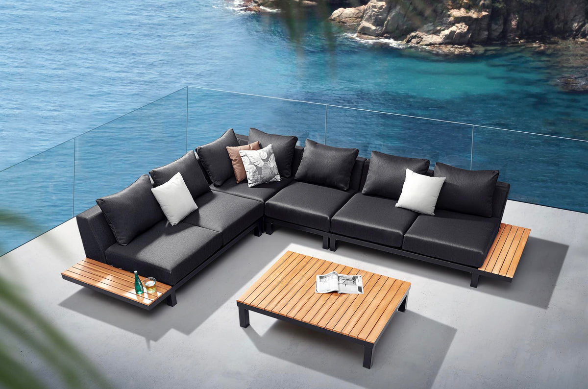 Orsy matte black aluminum and teak corner sofa set with low teak coffee table – shown outdoors (3)