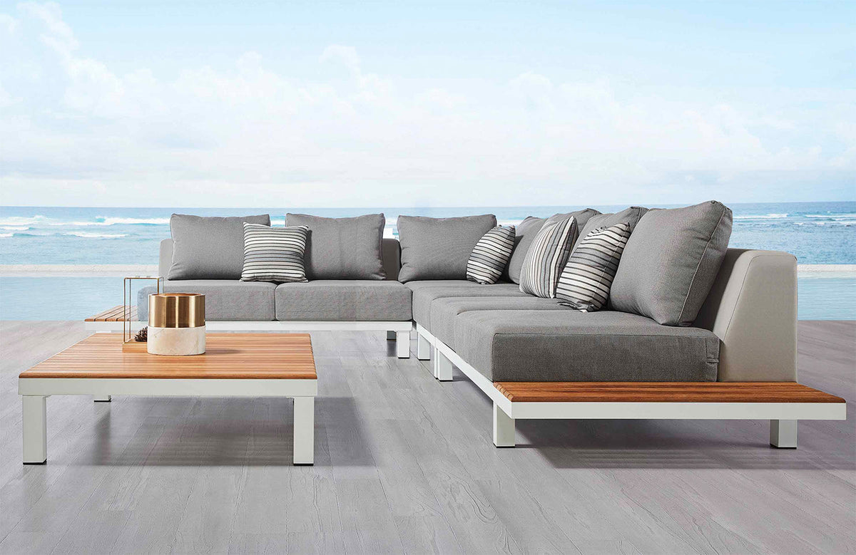 Orsy white aluminum corner lounge set with teak side tablets and teak coffee table – shown outdoors (4)