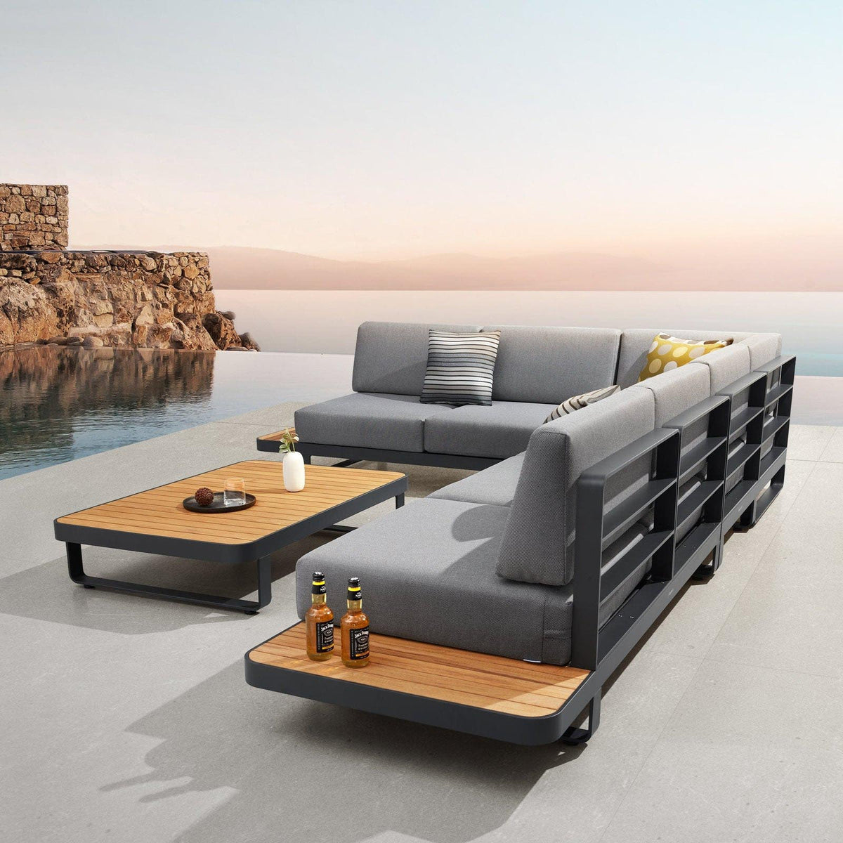 Many aluminum and teak corner sofa with teak-top coffee table – shown outdoors