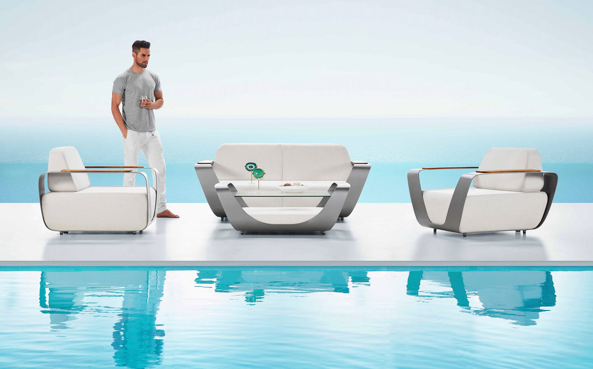 Onda aluminum Sunbrella patio set with loveseat, armchairs and teak coffee table – shown outdoors (4)