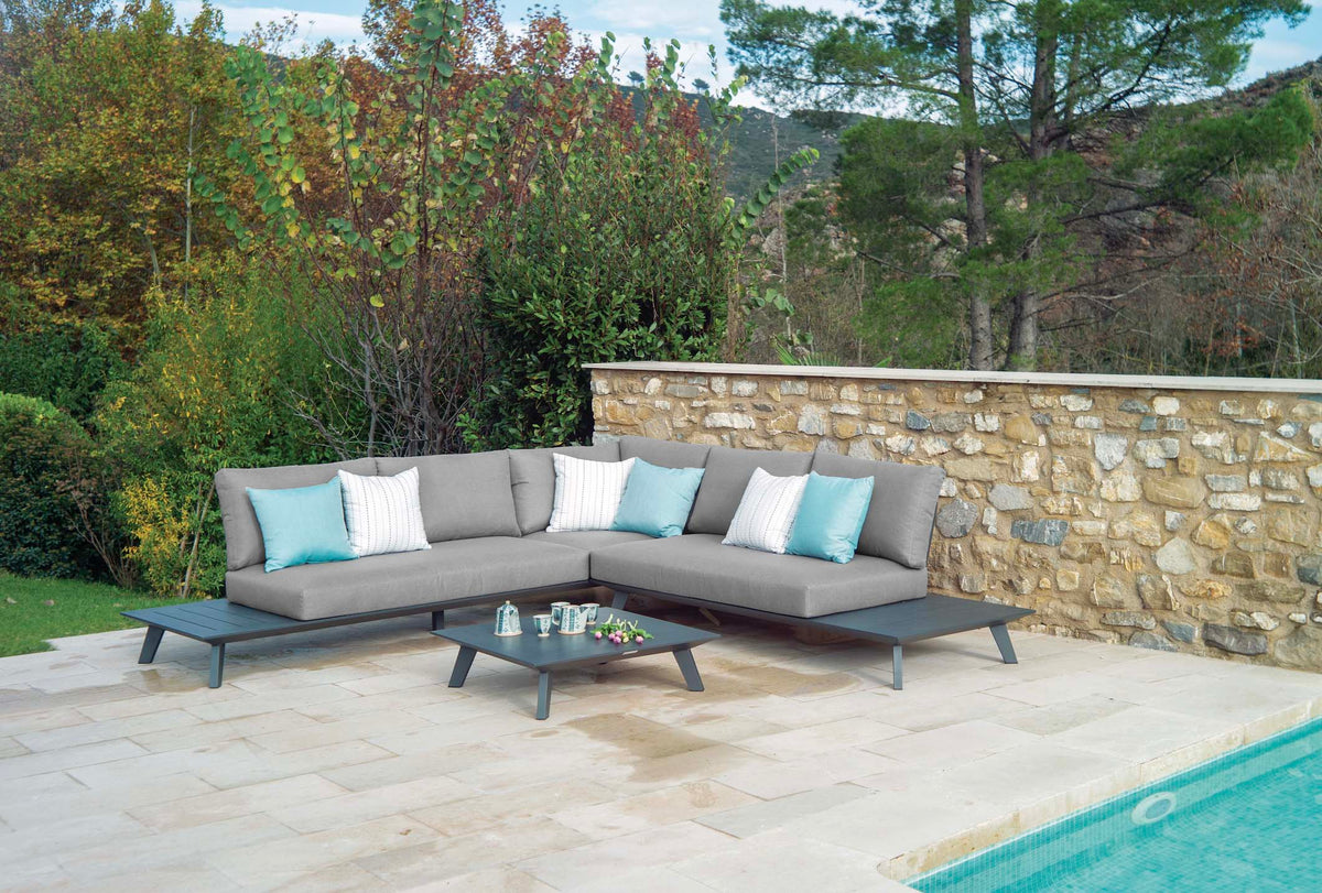 Tiny black modular aluminum outdoor sofa with chaise and square coffee table – shown outdoors (3)