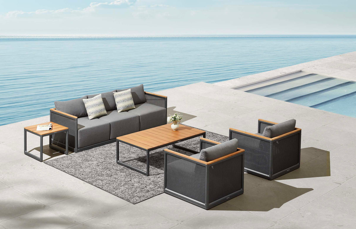 Rio 5-seat aluminum and teak lounge set with large teak coffee table – shown outdoors (4)