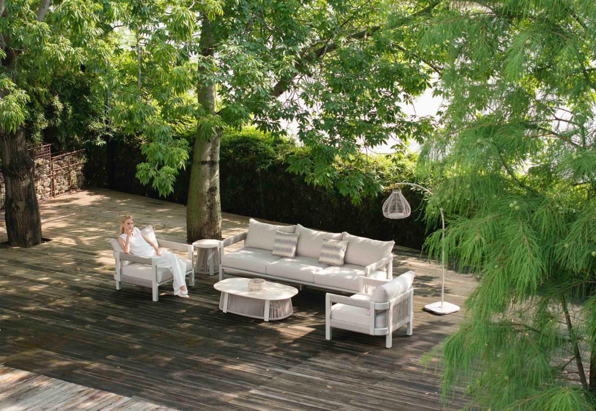Apollo beige arched solar outdoor floor lamp – shown outdoors