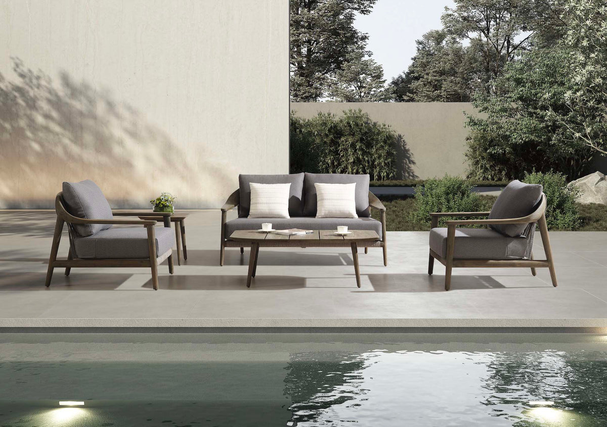 Come solid teak and beige rope patio set with loveseat and two armchairs – shown outdoors (4)
