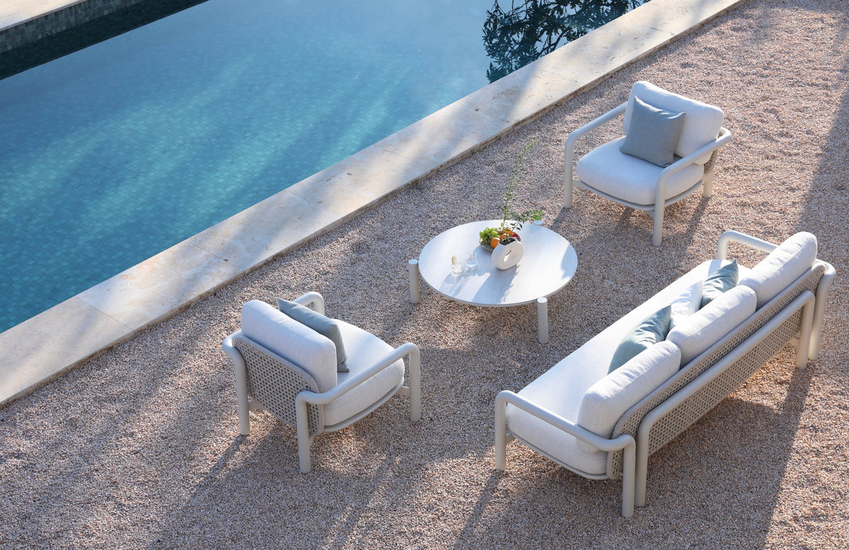 Amaia aluminum and rope patio set with cylindrical sofa and ceramic table – shown outdoors (4)