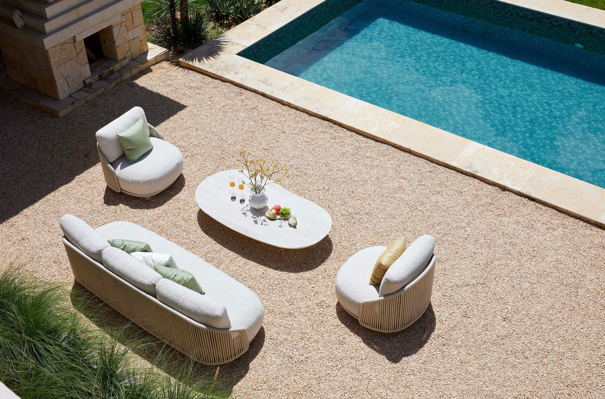 Aura beige rope outdoor lounge set with free-form ceramic coffee table – shown outdoors (4)