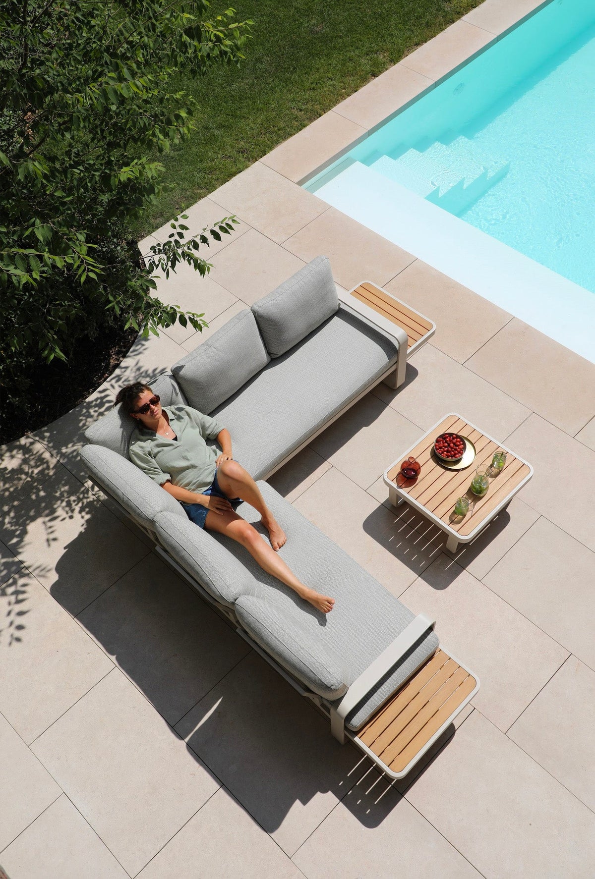 Emilia beige aluminum and teak modular outdoor sectional – shown outdoors (2)