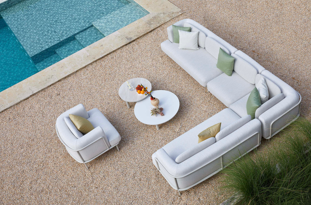 Flora white aluminum outdoor sectional with light gray cushions – with armchair variant, shown outdoors