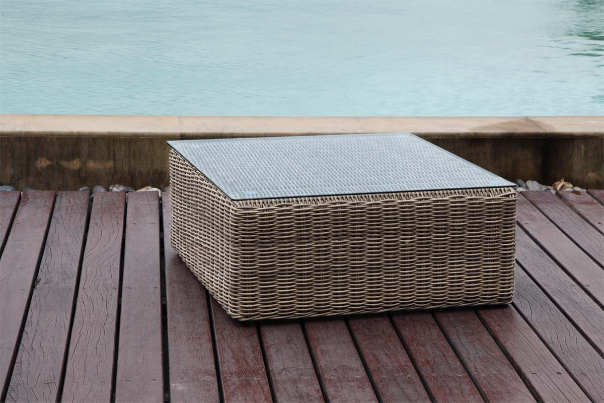 Coffee table from the Liberty Smart 6-seat modular resin wicker sectional – shown outdoors